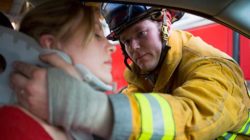 firefighter and injured woman