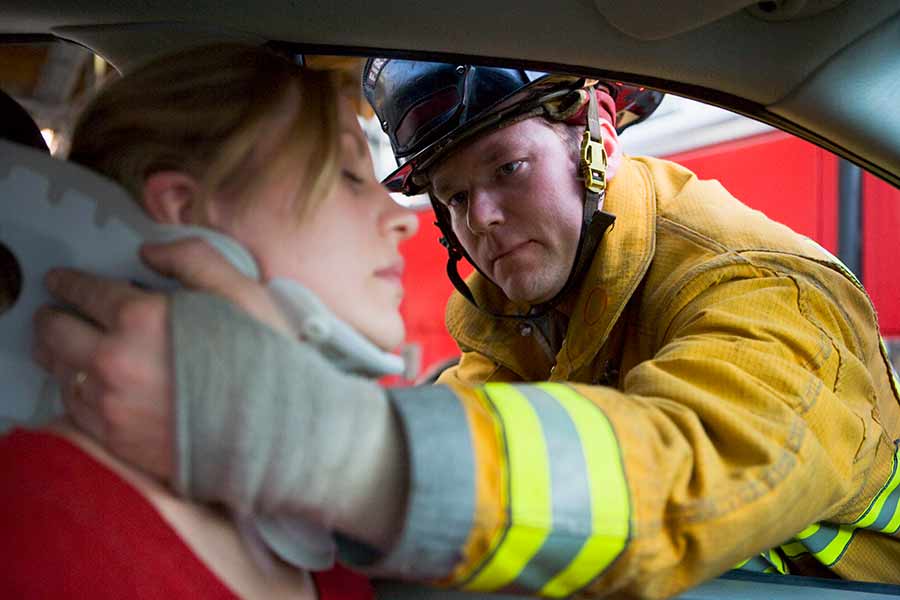 firefighter and injured woman