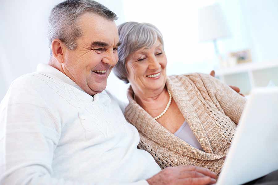 Senior couple on laptop